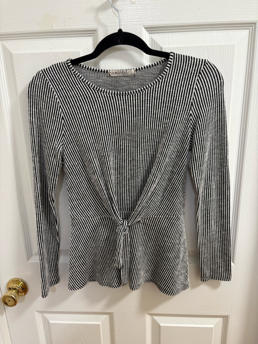 Black/white striped long sleeve peplum top with a tie-front  from Free Market.